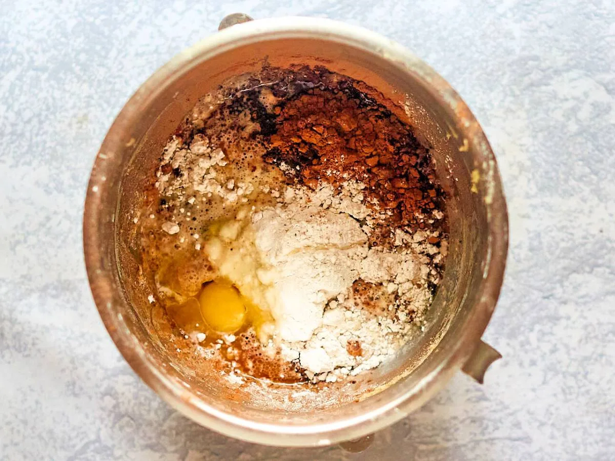 A mixing bowl filled with bread ingredients before mixing - Hostess At Heart