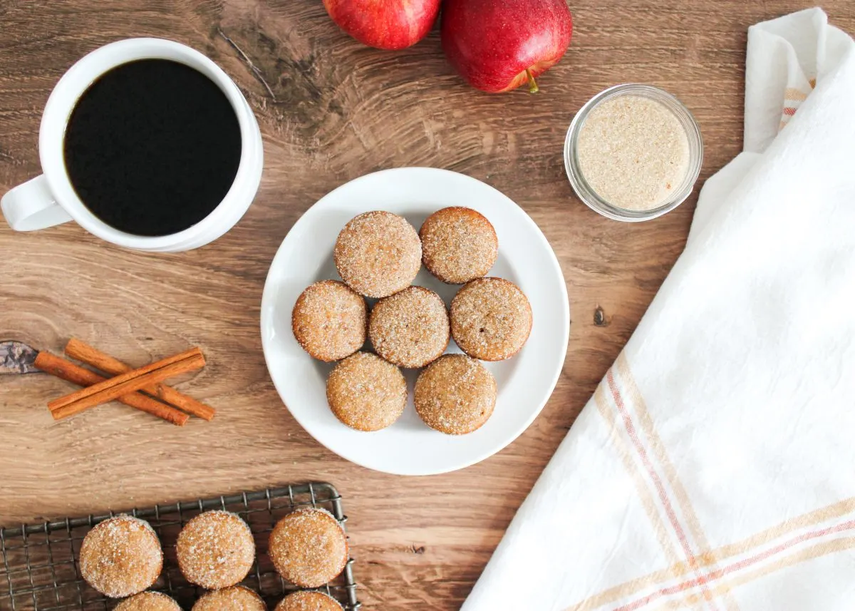 Top down view of baked mini muffins topped with cinnamon and sugar - Hostess At Heart