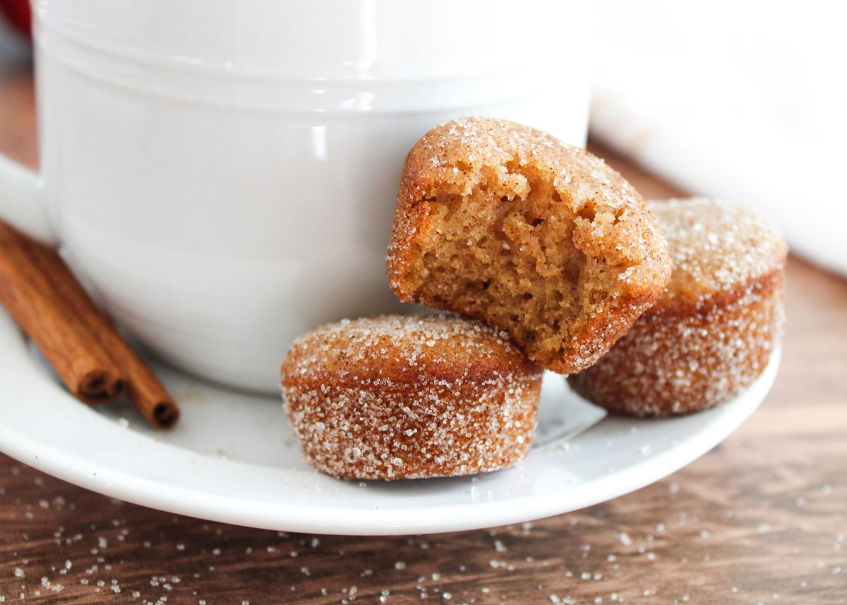 A cup of coffee sitting on a sauce holding three mini homemade apple muffins - Hostess At Heart