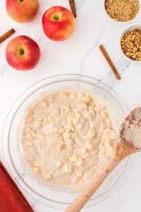 Top down view of a bowl filled with apple muffin batter - Hostess At Heart