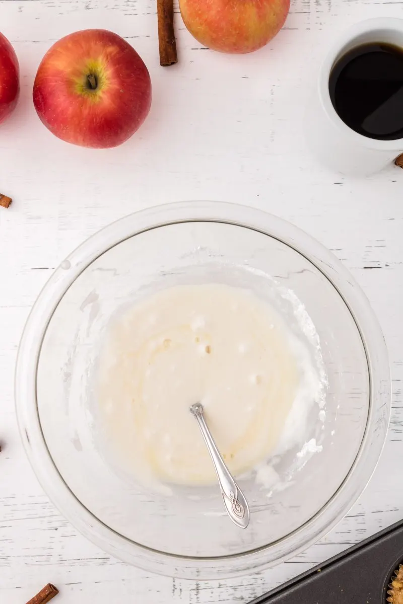 Top down view of smoothly mixed sugar glaze in a glass bowl. Hostess At Heart