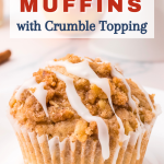 A table view of a baked Apple Crumble Muffin with glaze dripping off the side. Hostess At Heart