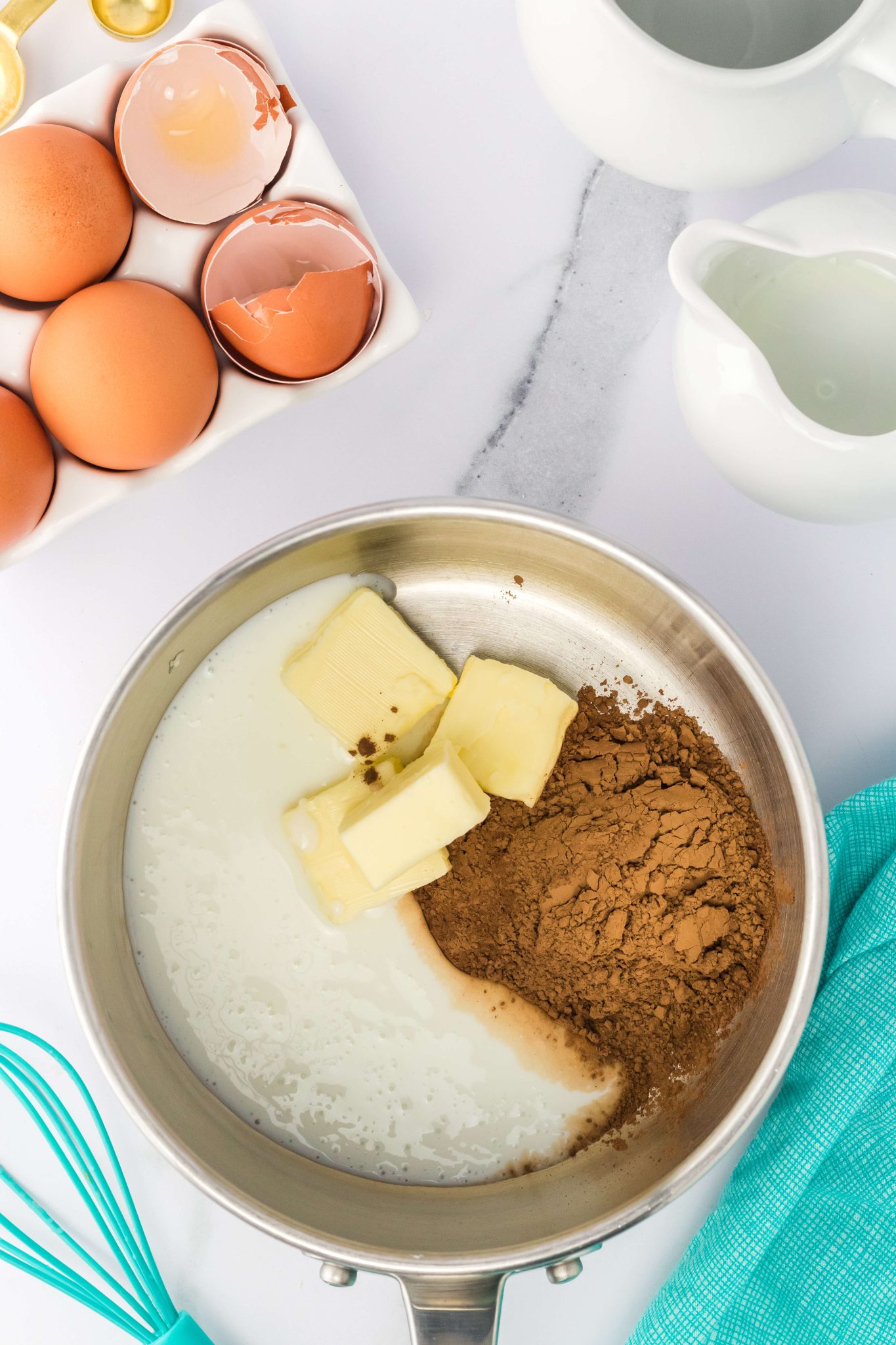A saucepan filled with cocoa, buttermilk and butter - Hostess At Heart