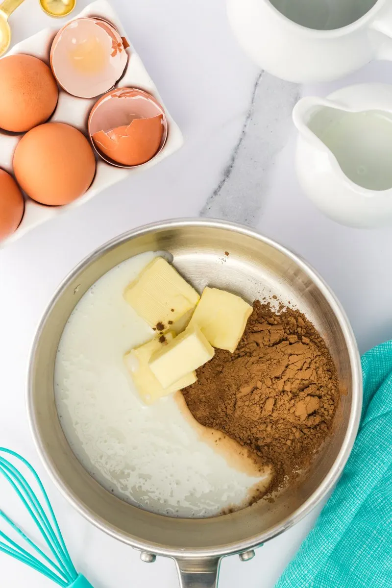 A mixing bowl filled with cocoa, buttermilk, and butter. Hostess At Heart