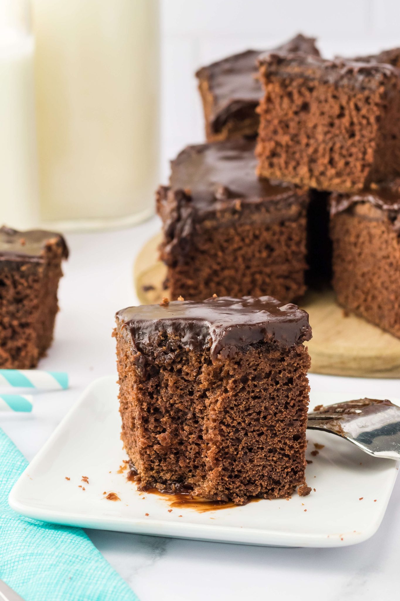 Tableview of a piece of brownie topped with buttermilk frosting - Hostess At Heart