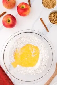 Melted butter added to flour in a bowl. Hostess At Heart