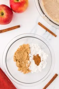 A bowl containing brown sugar, cinnamon, and flour. Hostess At Heart