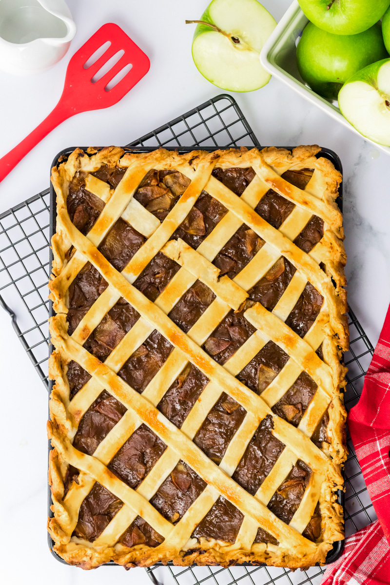 Top down image of a sheet pan apple pie with a lattice crust - Hostess At Heart