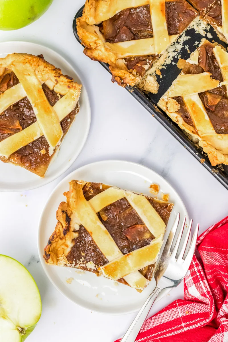 Top down view of two slices of an apple slab pie with a lattice crust.