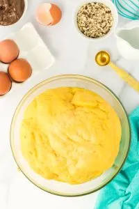 Top down view of bread dough rising in a glass bowl - Hostess At Heart