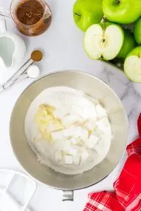 A mixing bowl filled with flour, shortening, and butter. Hostess At Heart