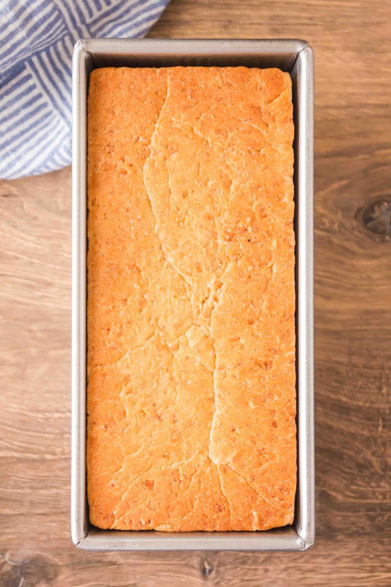 Top down view of a loaf of baked bread in a pullman loaf pan - Hostess At Heart