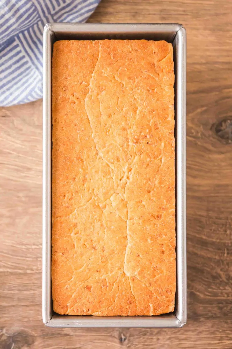 Top down view of a loaf of baked bread in a pullman loaf pan - Hostess At Heart