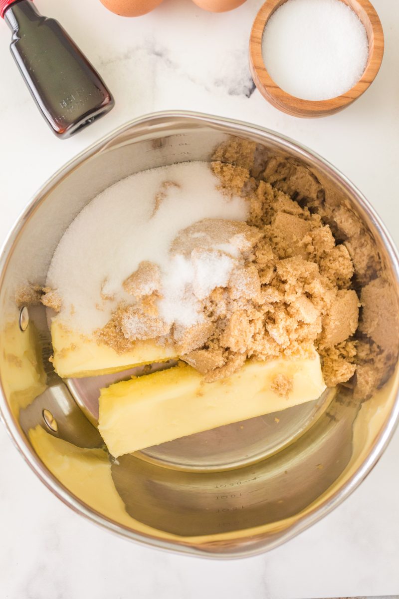 A mixing bowl containing butter, white sugar, and brown sugar - Hostess At Heart
