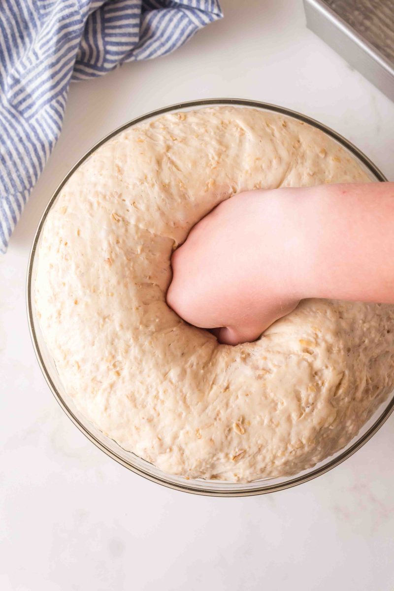 Punching down a bowl of risen dough. Hostess At Heart