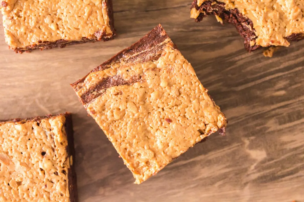 Top down view of pieces of peanut butter topped chocolate brownies - Hostess At Heart