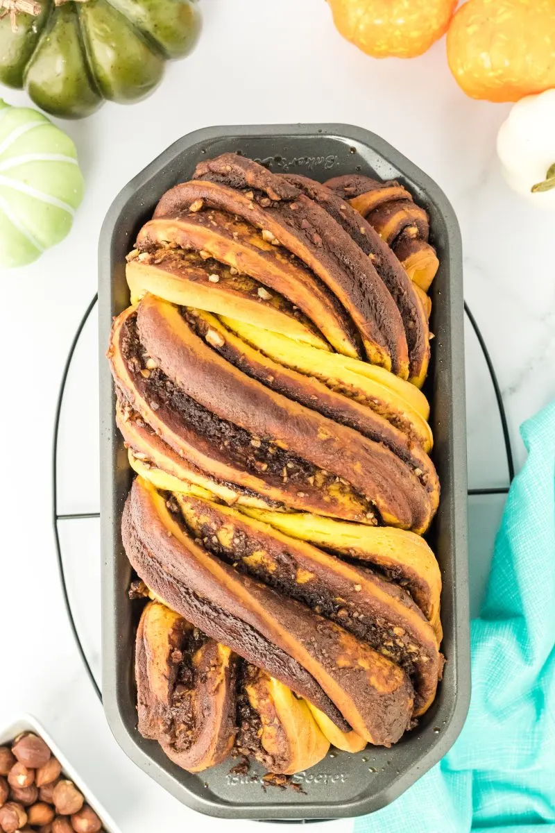 Top down view of a loaf of pumpkin babka bread with swirls of Nutella. Hostess At Heart