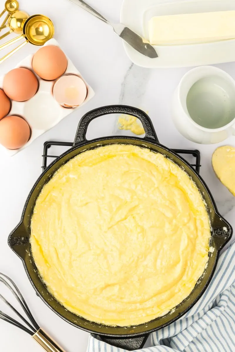 Corn bread batter in a cast iron skillet - Hostess At Heart