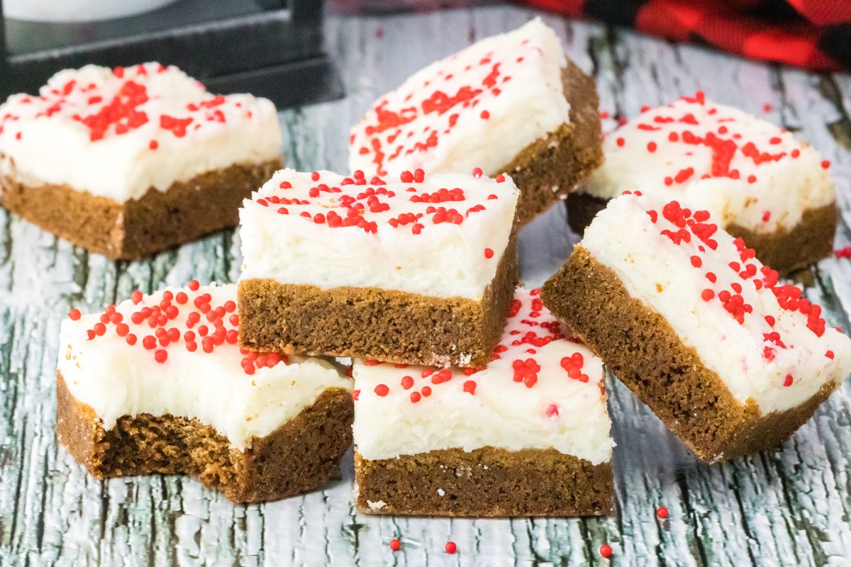 Side View of Gingerbread Bars topped with cream cheese frosting - Hostess At Heart