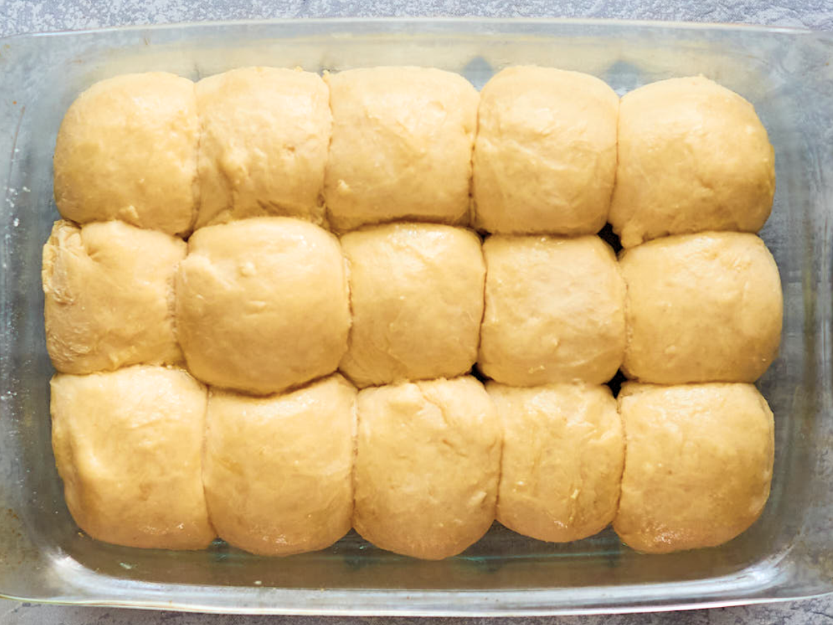 Pan of risen dough rolls - Hostess At Heart