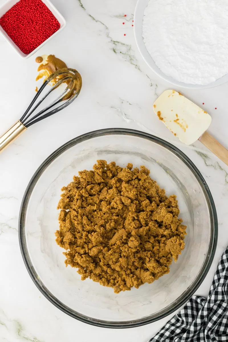 Crumbled gingerbread batter in a bowl - Hostess At Heart