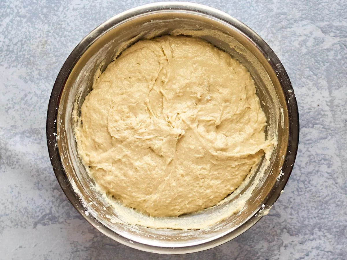 Top down view of sticky bread dough in a bowl - Hostess At Heart