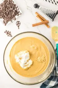 Whipped topping being folded into Pumpkin Spice Mousse - Hostess At Heart