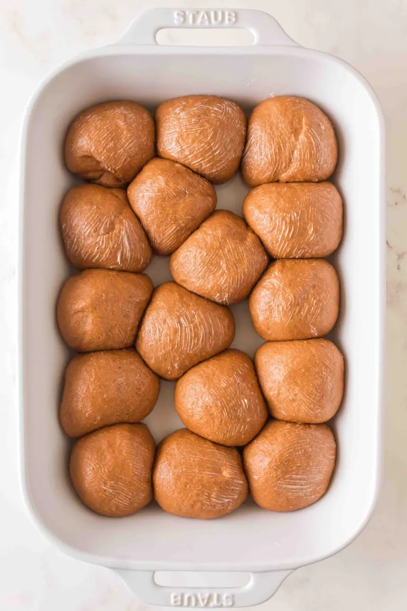 Top down view of shaped bread rolls brushed with butter - Hostess At Heart