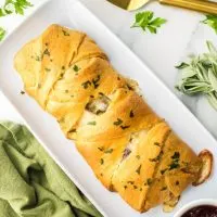 Top down view of a baked Turkey and Cheese Crescent Roll Braid - Hostess At Heart
