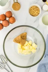 Top down view of a bowl of butter and peanut butter waiting to be creamed together. Hostess At Heart