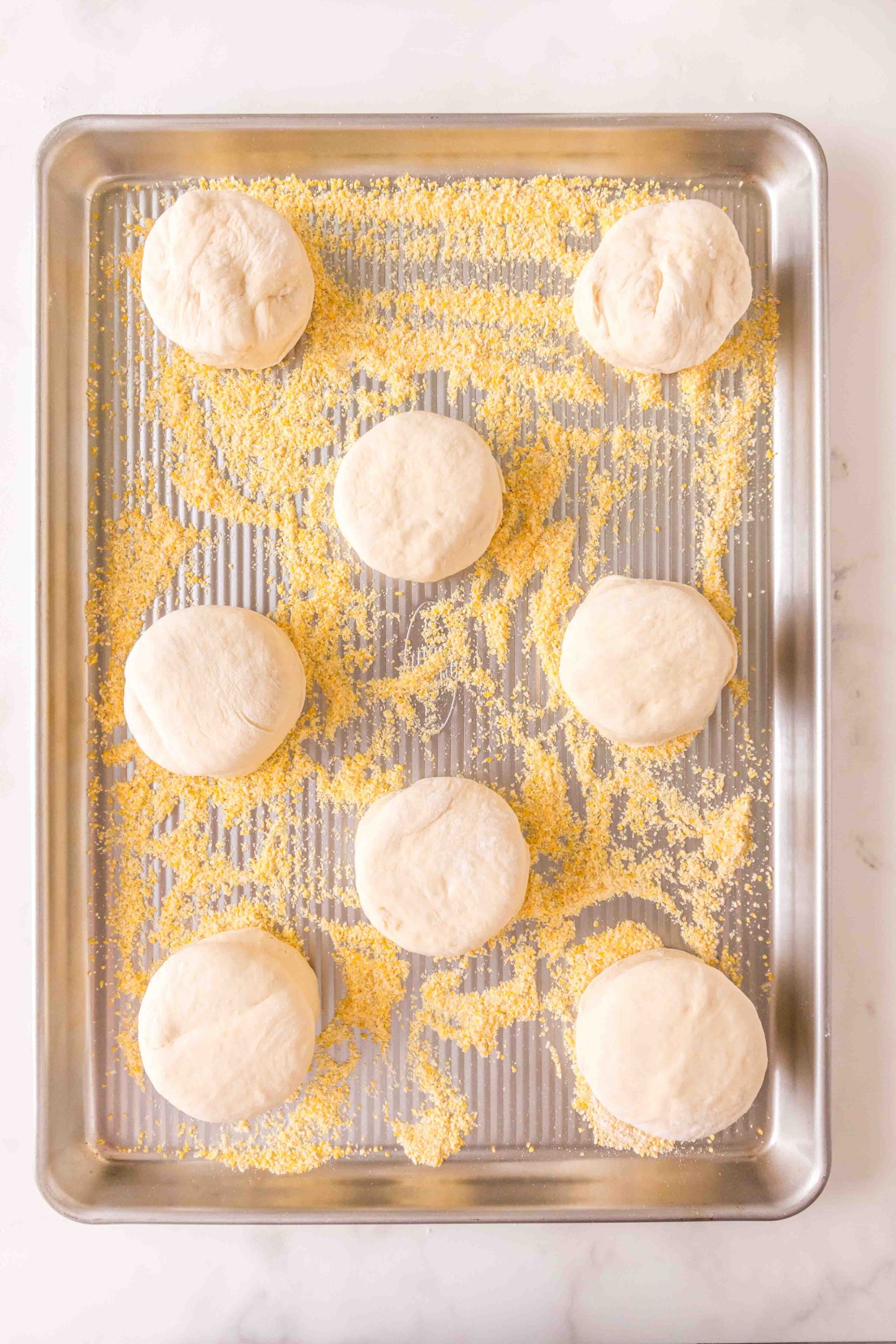 Cut dough on a baking sheet sprinkled with cornmeal to prevent sprinkling - Hostess At Heart