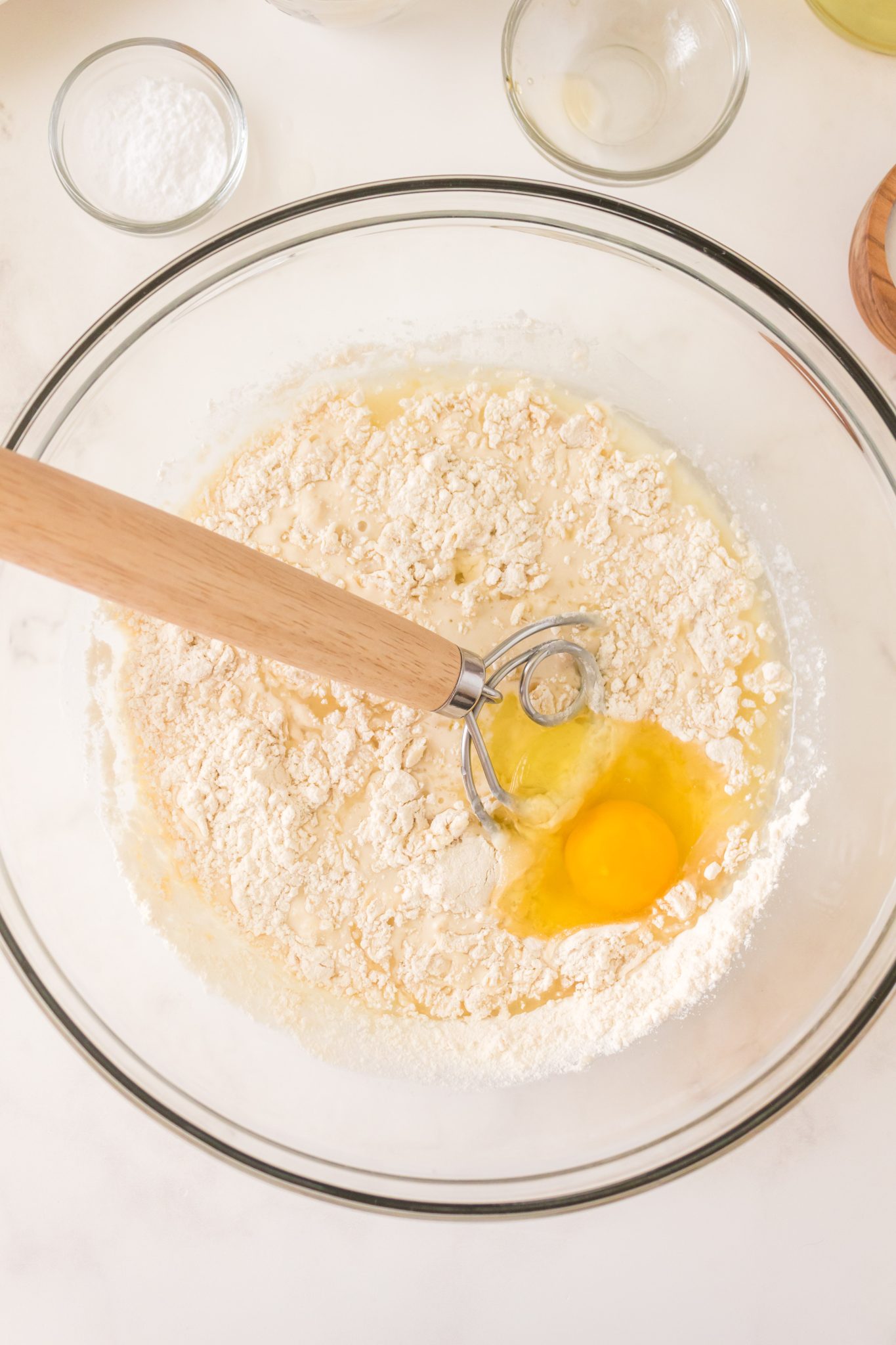 Dry sourdough discard pancake recipe ingredients combined with wet ingredients and an egg. Hostess At Heart