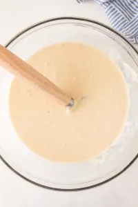 Top down view of a bowl filled with sourdough starter pancake batter - Hostess At Heart