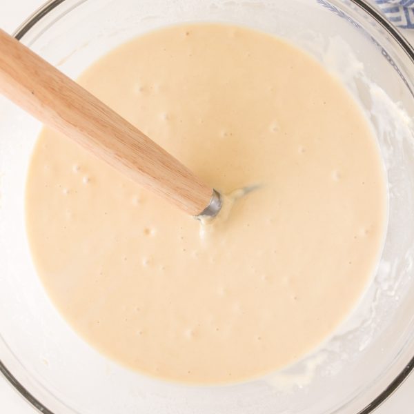 Top down view of a bowl filled with sourdough starter pancake batter - Hostess At Heart