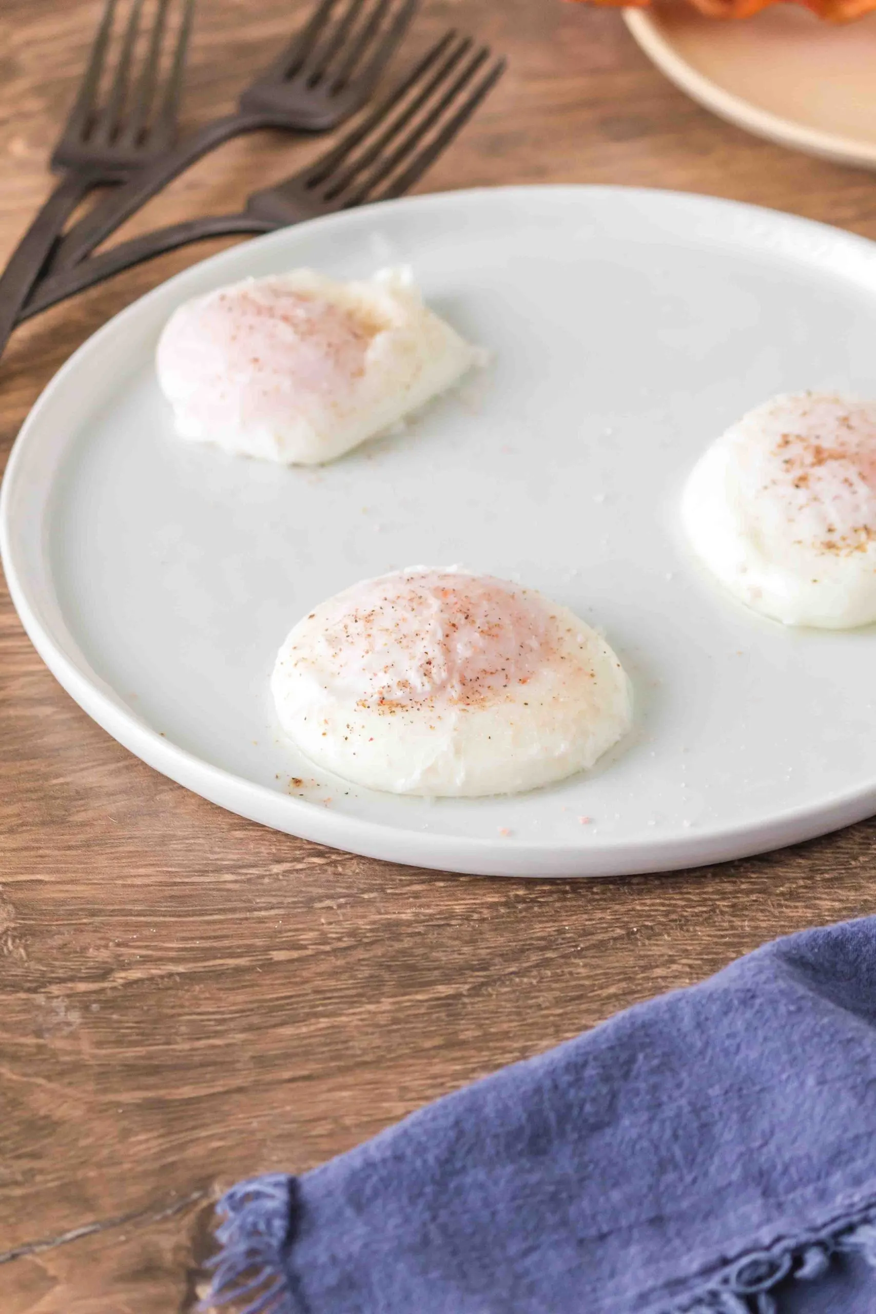 Three poached eggs on a plate - Hostess At Heart