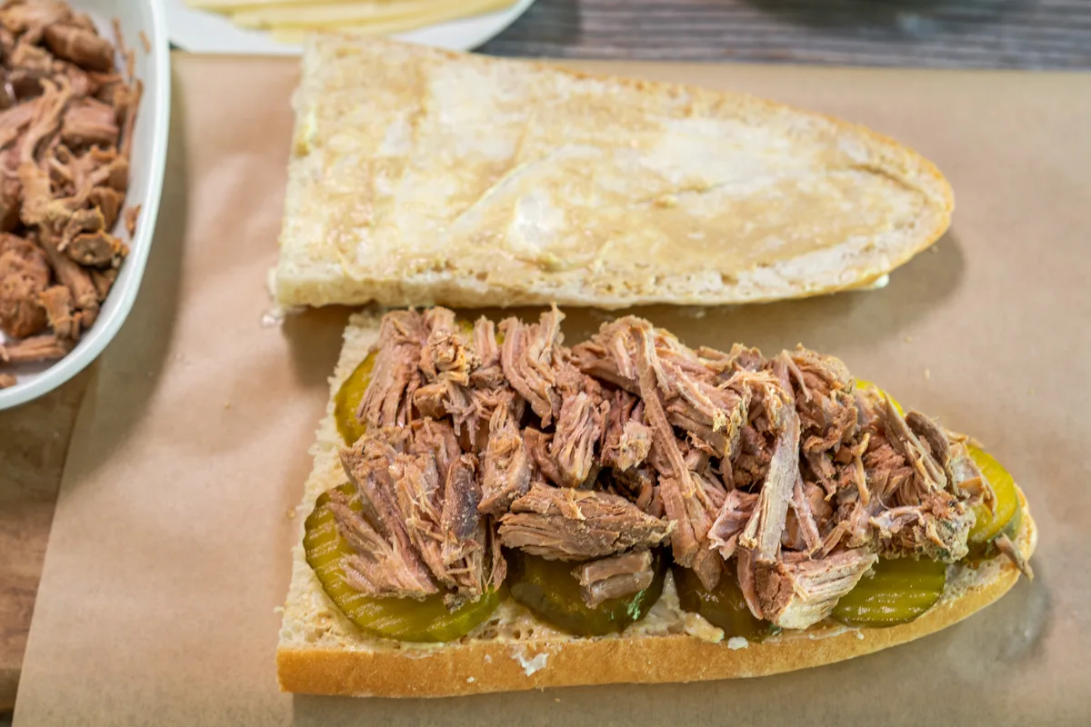 Roasted and shredded Mojo Pork layered in a Cubano sandwich. Hostess At Heart