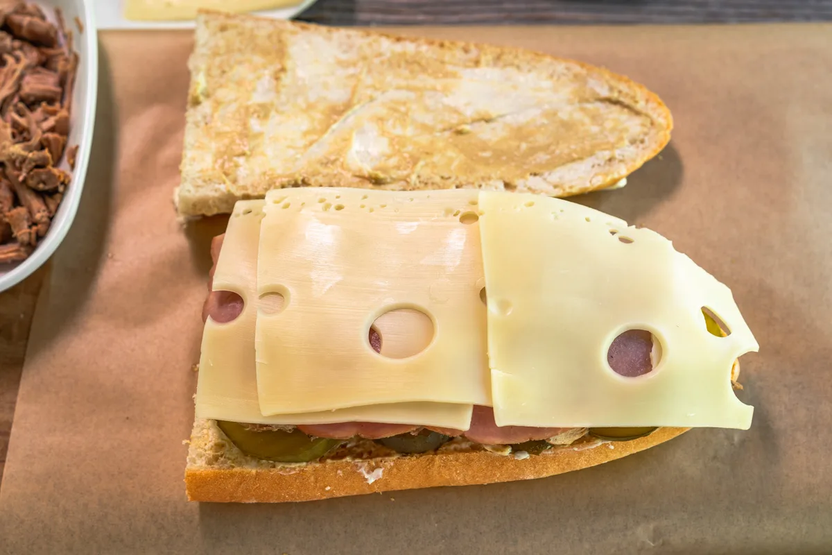 A face open sandwich with a layer of Swiss cheese. Hostess At Heart