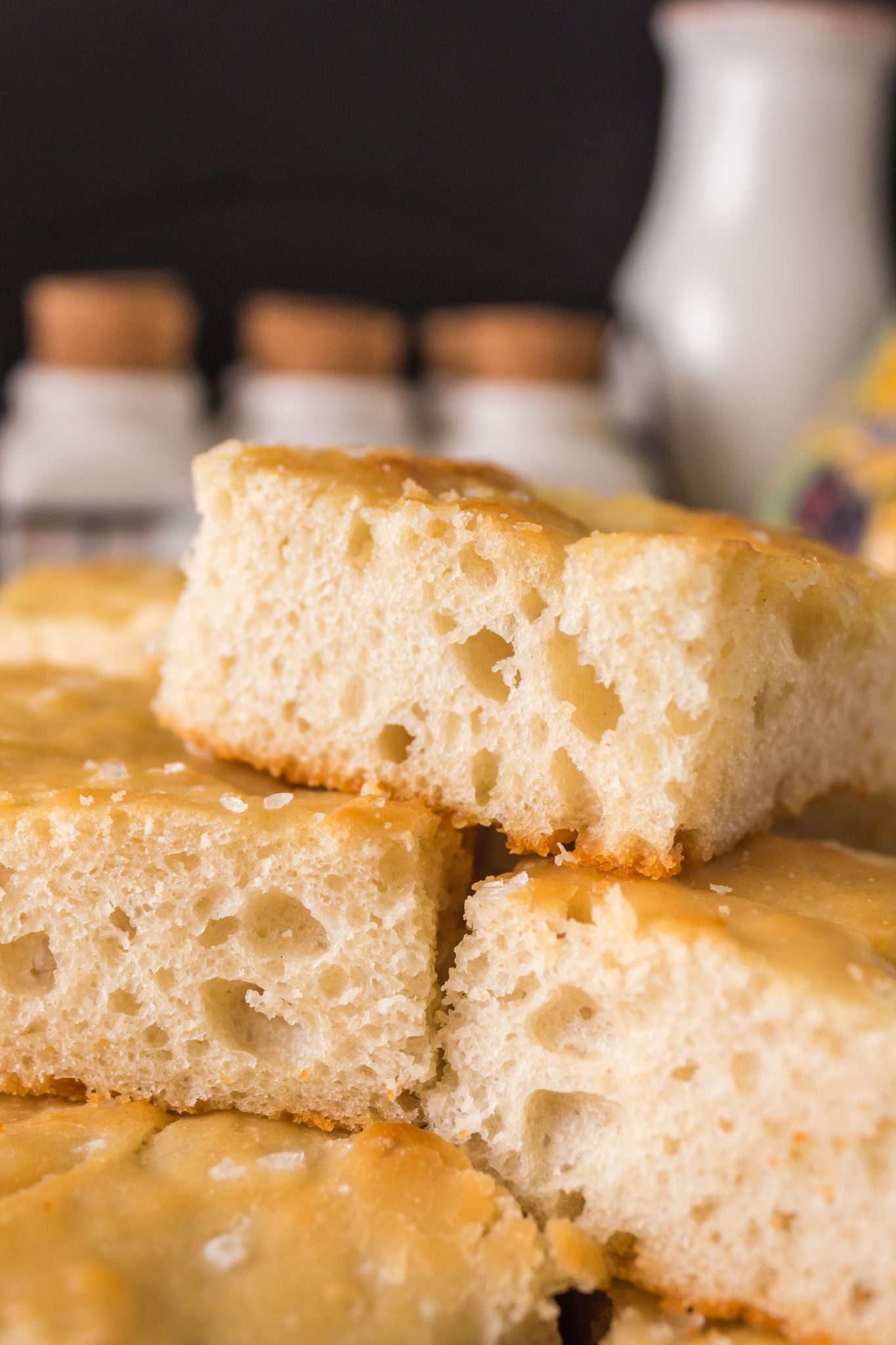 Front view of pieces of foccacia sitting on top of each other - Hostess At Heart
