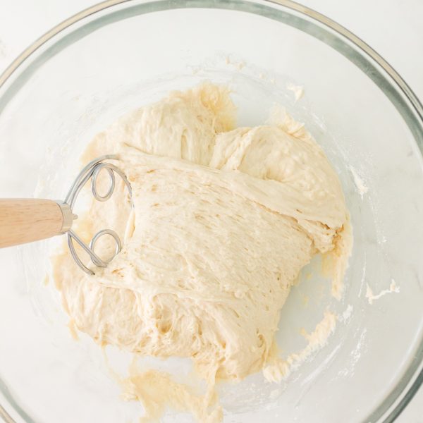 A Danish whisk folding bread dough from one side of the bowl to the other. Hostess At Heart
