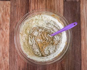 Flour added to a bowl of sourdough sponge - Hostess At Heart