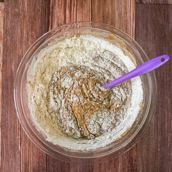 Flour added to a bowl of sourdough sponge - Hostess At Heart