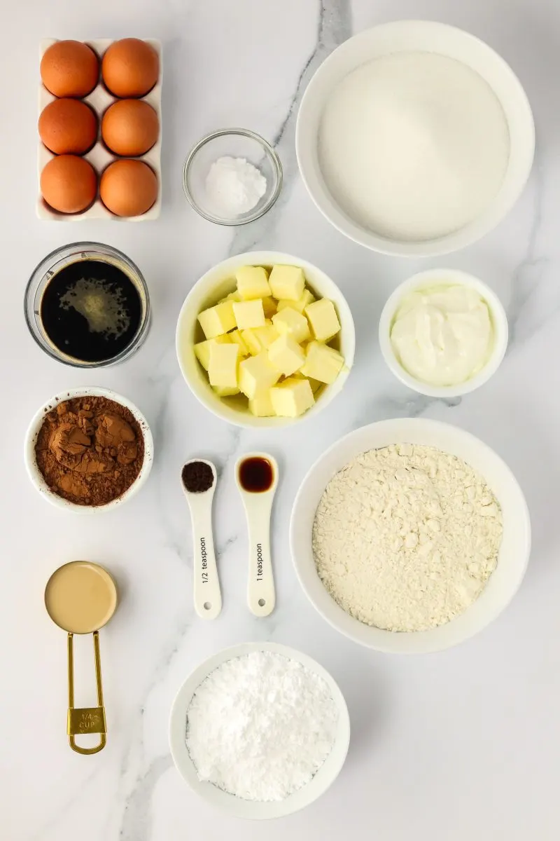Ingredients for Irish Stout Cake: Eggs, butter, cocoa, coffe, flour, baking soda, stout beer, sugar, sour cream, eggs, and vanilla. Powdered sugar and Irish Cream for the glaze. Hostess At Heart