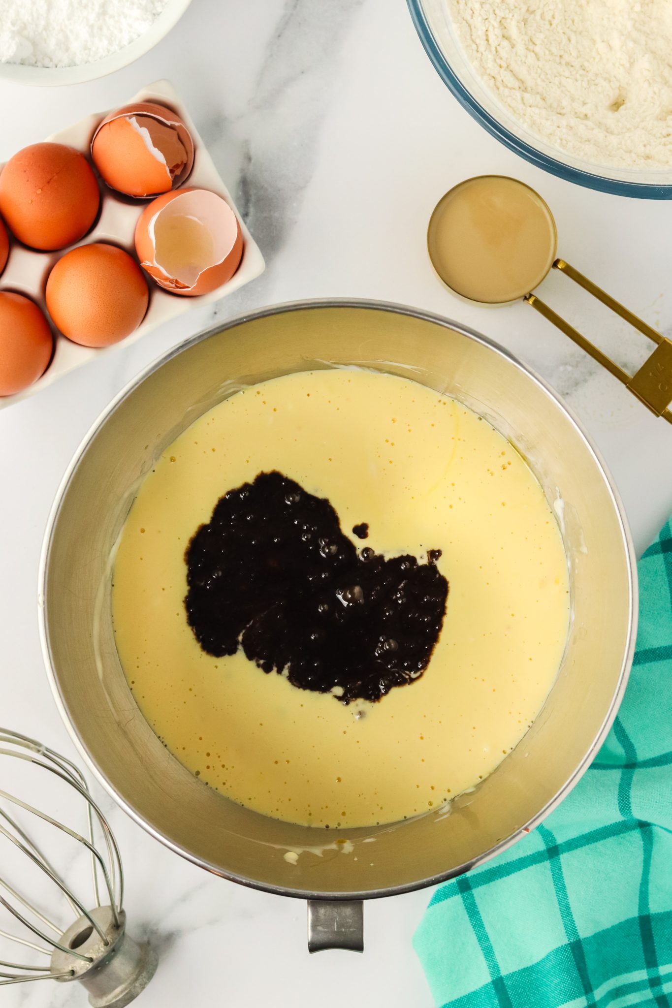 A mixing bowl filled a blend of sour cream and eggs, topped with chocolate stout mixture. Hostess At Heart