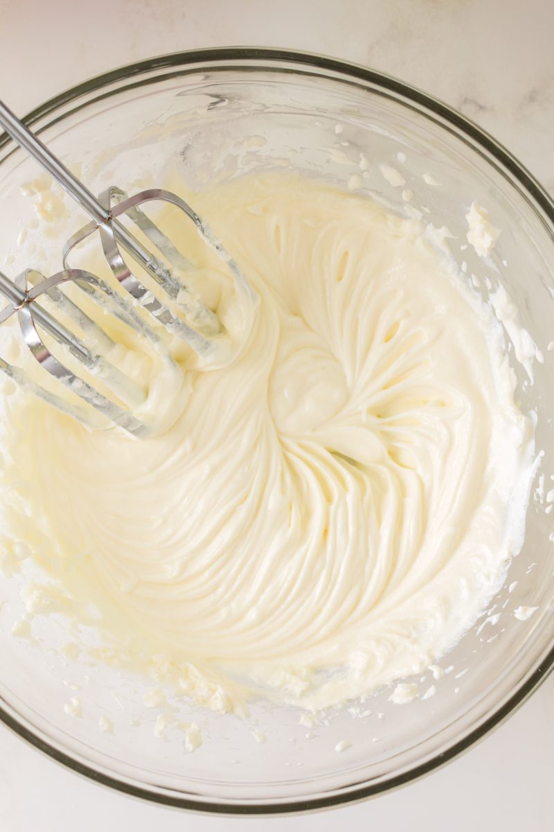 Cream cheese filling whipped smooth in a mixing bowl - Hostess At Heart