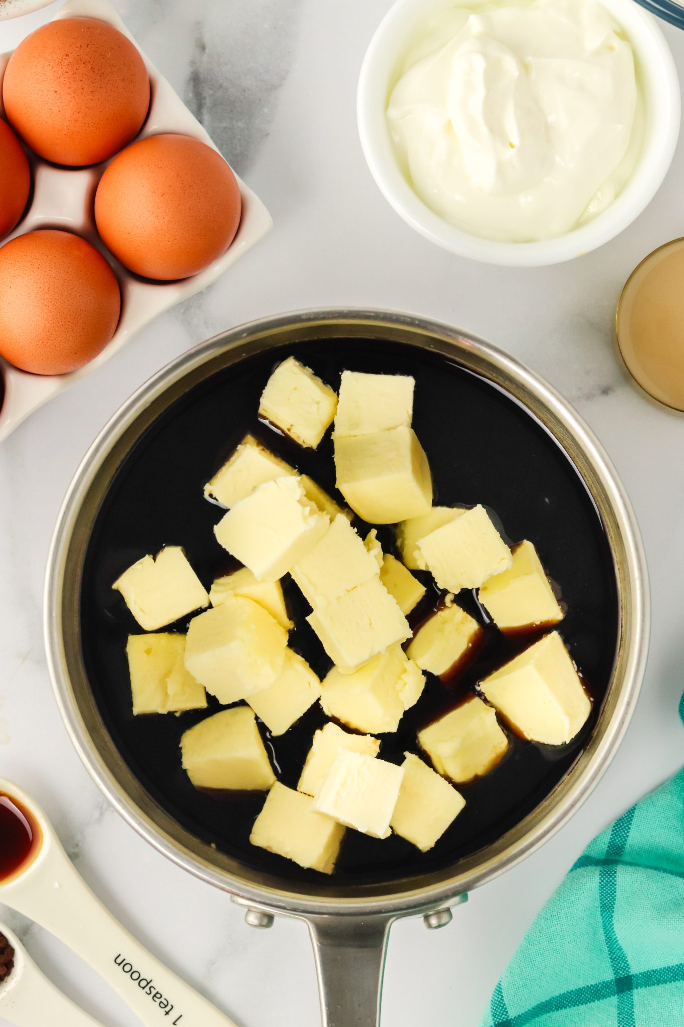 A saucepan filled with stout beer and cubes of butter. Hostess At Heart