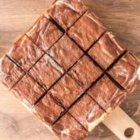 Top down view of the entire recipe of brownies with cream cheese sliced into square pieces - Hostess At Heart