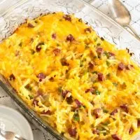 Top down view of a baking dish filled with an egg casserole containing potatoes and diced corned beef - Hostess At Heart