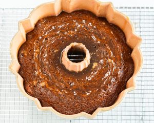 Top down view of a baked bundt cake infused with a rum syrup. Hostess At Heart