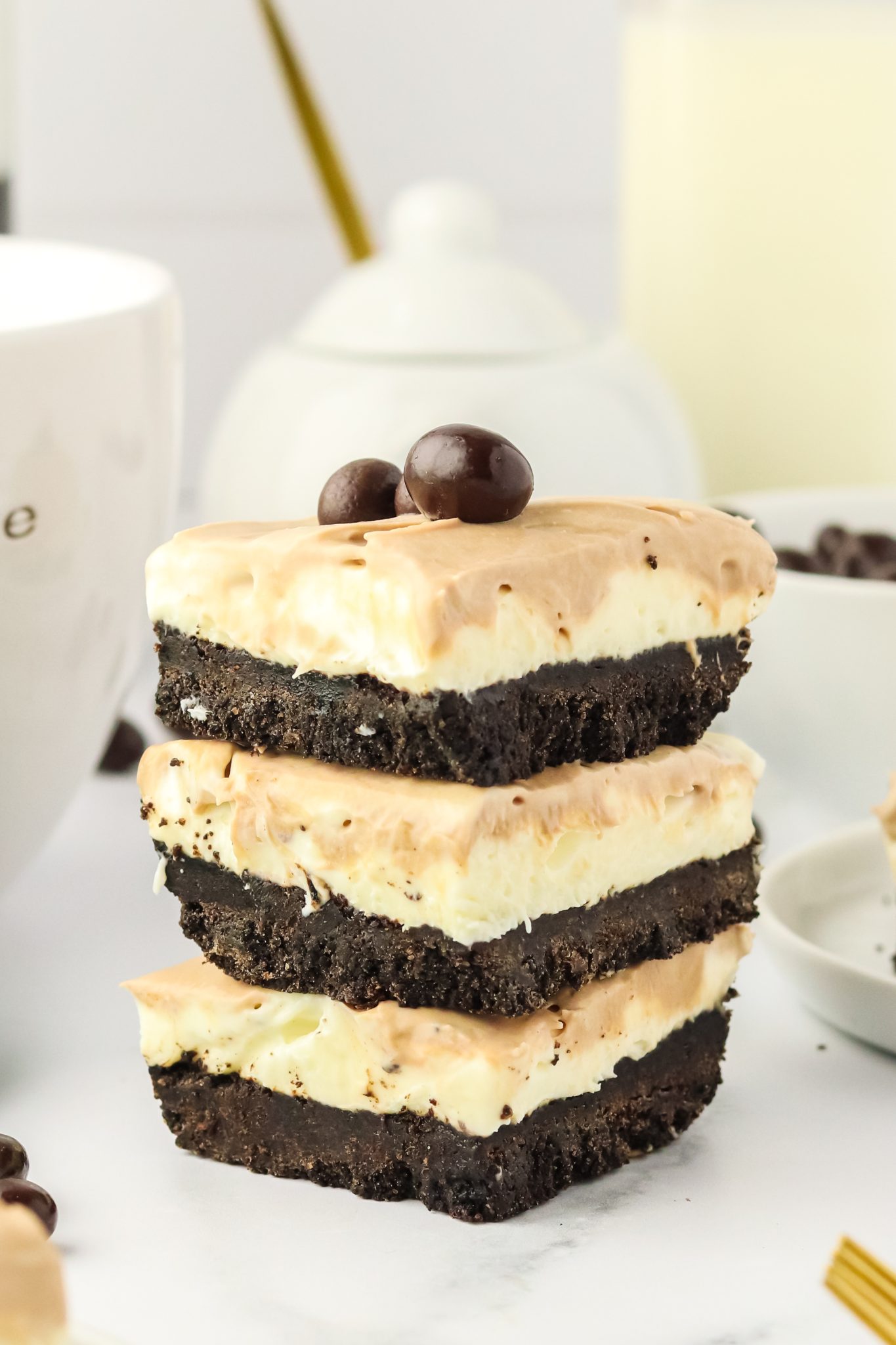 Stacked closeup of three Cappuccino Cheesecake - Hostess At Heart