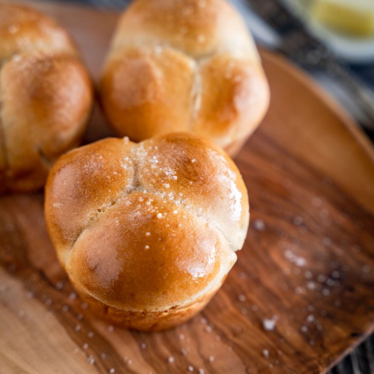 Sourdough clover leaf Dinner Rolls on a tray. Top down view of rolls. - Hostess At Heart